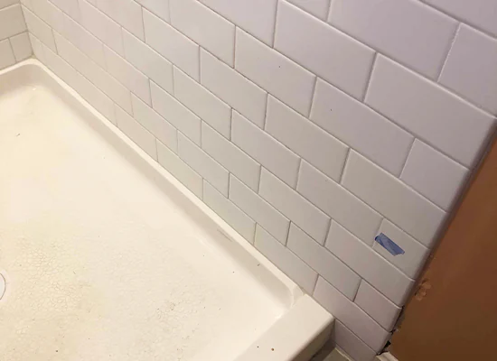 Shower wall tile repair after photo