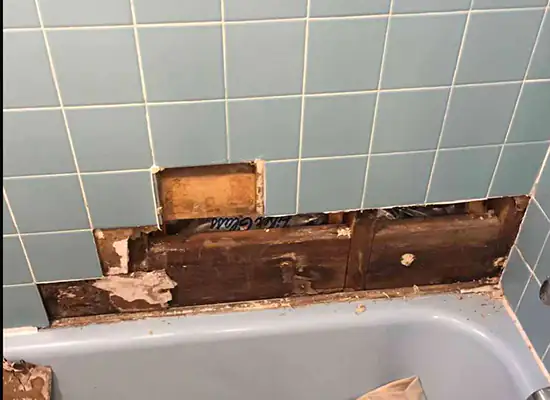 Tile repair in the tub area wall before repair